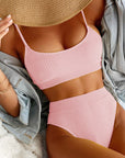 High waist bikini swimwear for women in pink ribbed design, featuring a scoop neckline and spaghetti straps.
