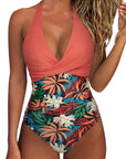 Women's backless multicolor swimsuit with tropical leaf pattern, perfect for summer beach days.