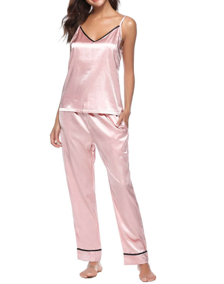 Women's silk sling plus trousers two-piece pajamas in soft pink, perfect for comfort and relaxation.