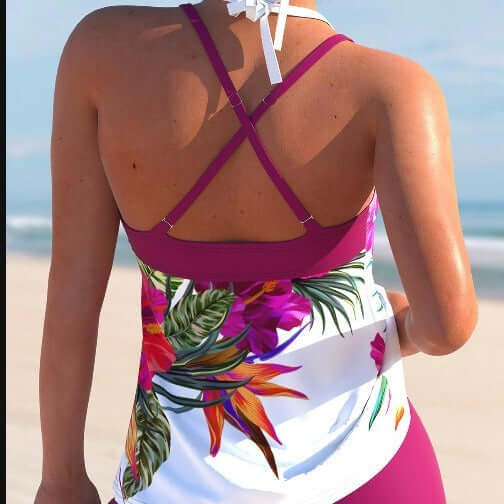 Back view of a women's purple and white floral swimsuit, perfect for beach and pool outings.