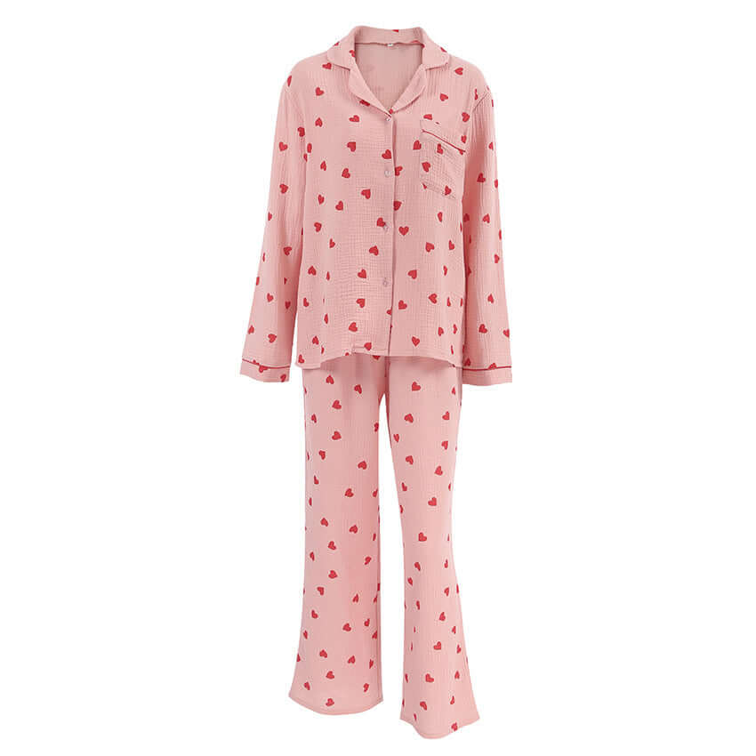 Comfortable soft cotton pajamas suit with heart prints in pink for women, featuring long sleeves and trousers.