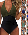 Women’s multicolor backless lace-up swimsuit, high-waisted and sexy, available in various floral and patterned styles.