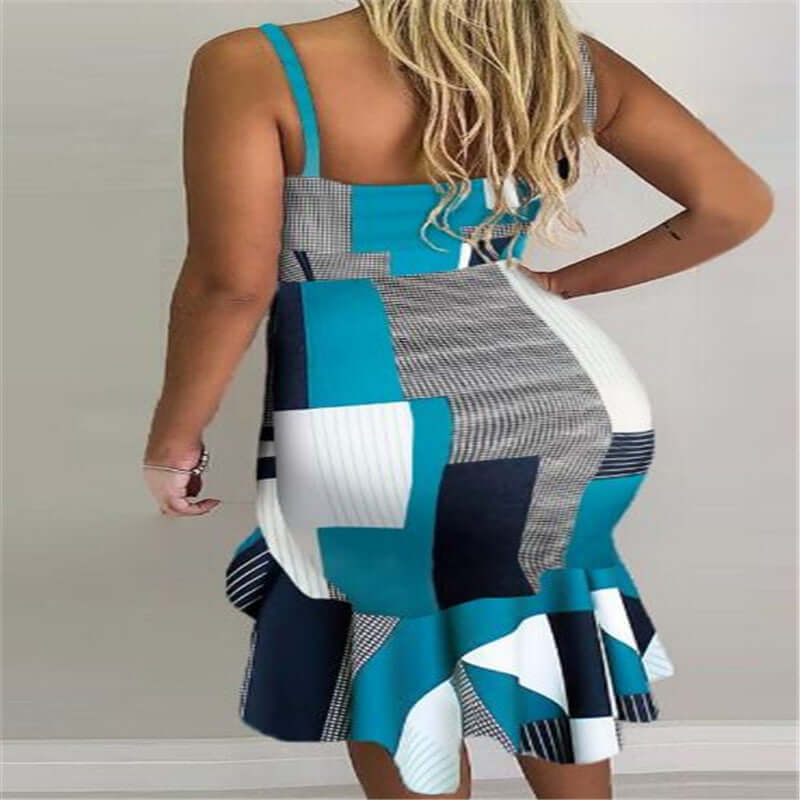 Back view of a woman wearing a blue and black collage halter irregular midi skirt dress in stylish design.