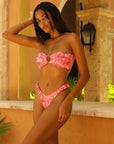 Women's split printed bikini swimsuit in vibrant pink, perfect for summer swimwear styles.