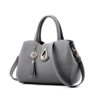 Stylish grey PU leather women's handbag with tassel and zipper closure, perfect for daily use and fashion-forward ensembles.