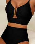Black high-waist bikini with V-neck and gold accessory, stylish women's swimwear for summer.