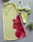 Three-piece yellow printed women's bikini swimsuit with floral design and matching cover-up, perfect for beachwear.