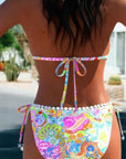 Back view of colorful women's bikini split swimsuit with floral print, perfect for swimming and wading.