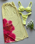 Three-piece women's swimwear featuring a yellow printed bikini and matching cover-up with floral design.