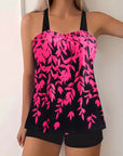 Plus size women's swimwear featuring a vibrant pink split leaf print bikini top and black bottoms.