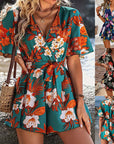 Stylish Beach Vacation Ruffle Sleeve Short Culottes Jumpsuit in vibrant floral print, perfect for women's summer outfits.