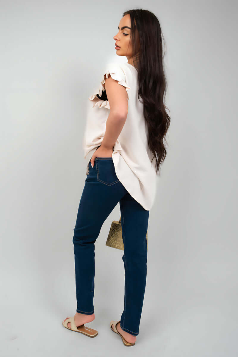 Model wearing Clara Straight Leg High Waist Jeans with a light top, showcasing a stylish casual look.