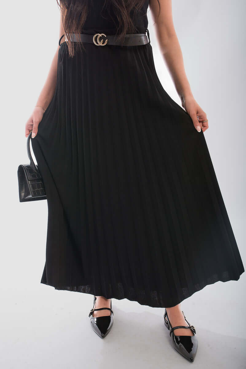 Belted maxi length pleated skirt made from organic cotton, featuring a relaxed fit and flowing design.
