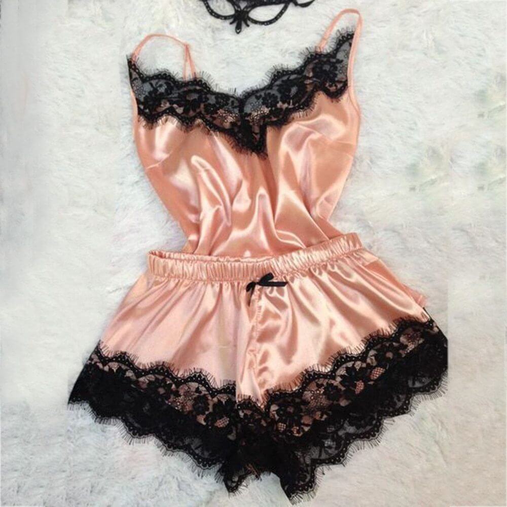 Women's ice silk pajamas jumpsuit in peach with black lace trim, stylish and comfortable sleepwear.