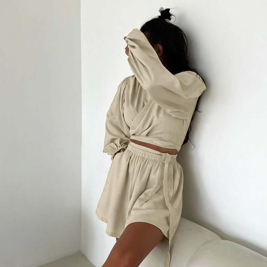 Casual two-piece khaki pajamas set featuring a stylish crop top and shorts, perfect for home or outdoor wear.