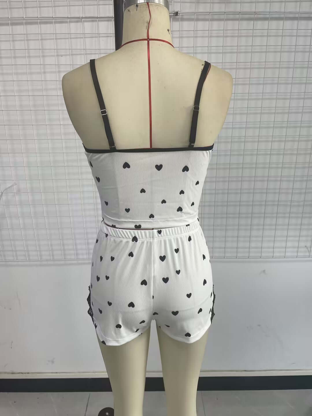 Back view of women's spaghetti-strap shorts pajamas with heart prints, perfect for casual sleepwear from Little Miss Vanilla Clothing.