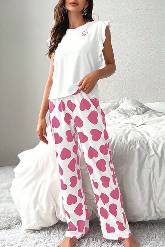 White ruffled tank top paired with pink heart print lounge pants for women's PJs by Little Miss Vanilla.