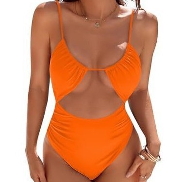 Stylish orange one-piece swimsuit for women, featuring a trendy cut-out design, perfect for summer swimwear.