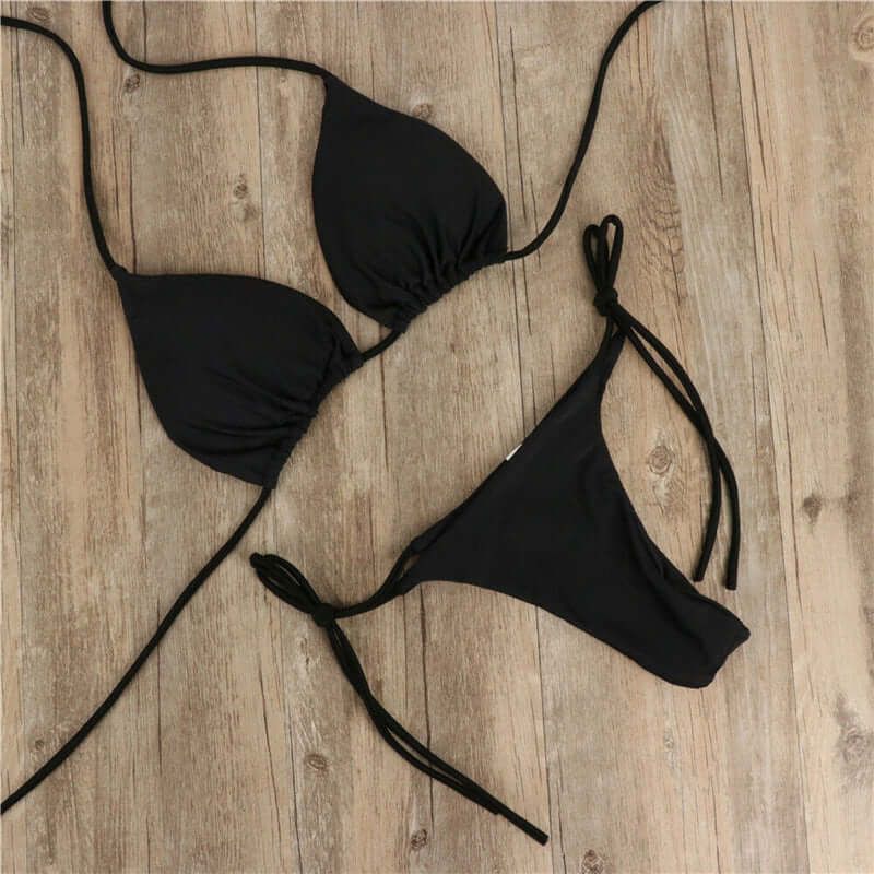 Black halter neck tie bikini swimwear for women, perfect for summer beach outings.