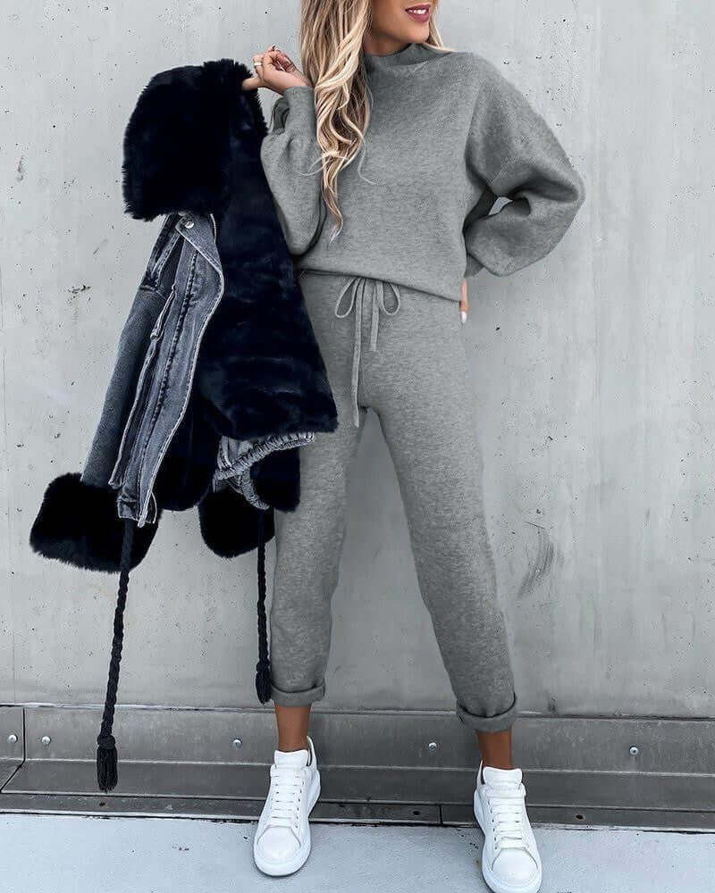 Casual high neck long sleeve grey pocket trousers two-piece suit with fur jacket and white sneakers.