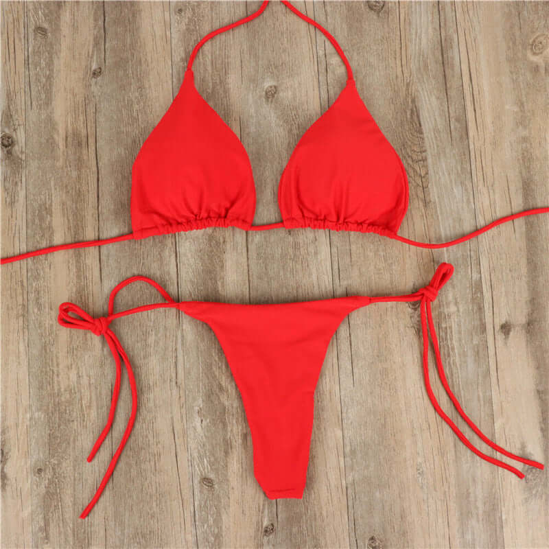Red halter neck tie bikini for women, perfect summer swimwear. Stylish and comfortable design, ideal for beach outings.