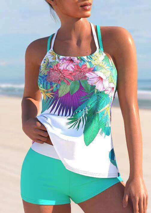 Ladies vibrant floral swimwear with shorts, perfect for beach days and summer fun.