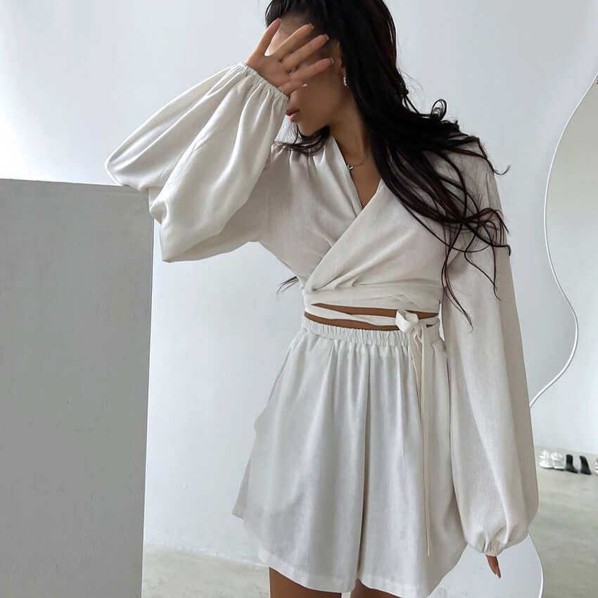 Fashion sexy pajama set in white, featuring a wrap top and shorts, perfect for casual and comfortable wear.