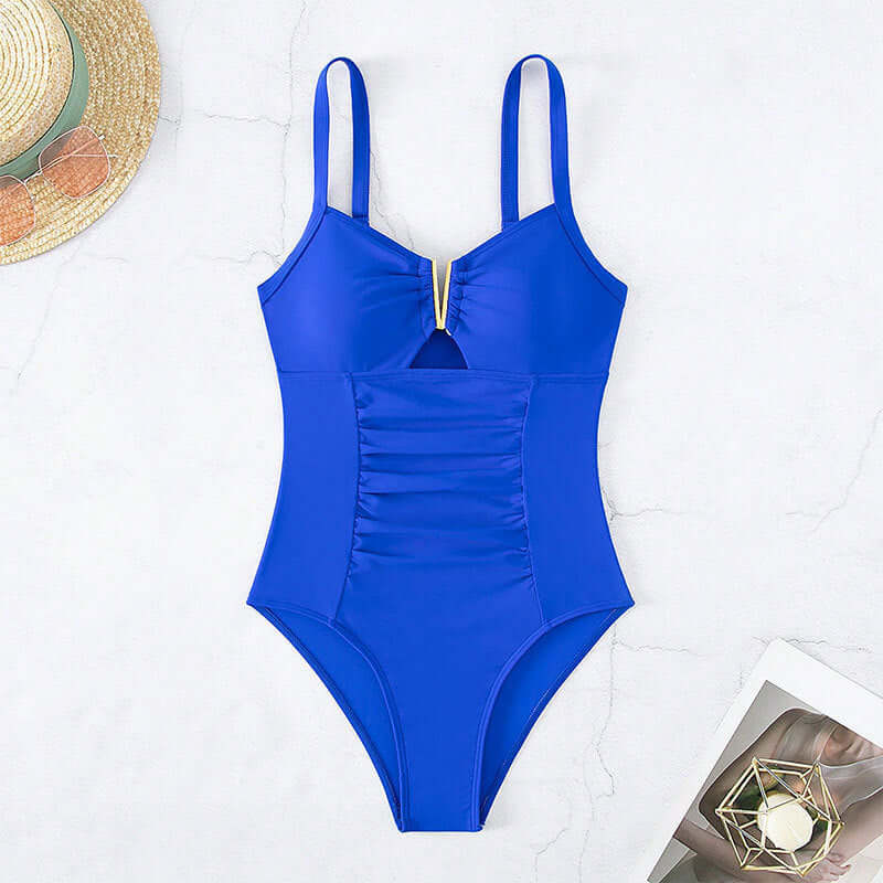 Women's solid blue body shaping one-piece bikini swimsuit on light background.