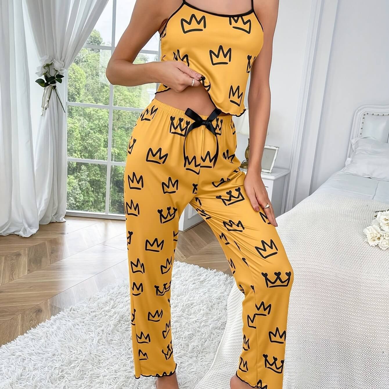 Two-piece milk silk suspender pajamas in yellow with crown print, perfect for casual wear and comfortable lounging.