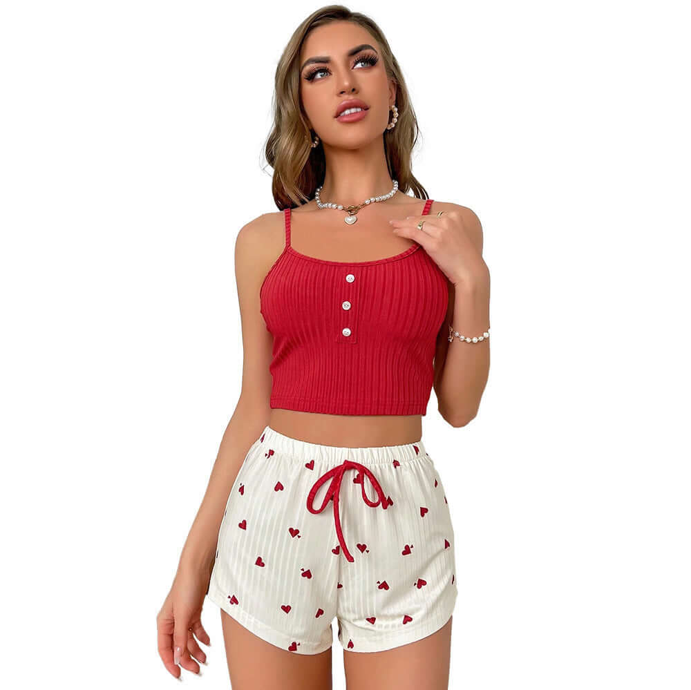 Model wearing red sleeveless top and heart-patterned shorts, perfect for outdoor style pajamas.