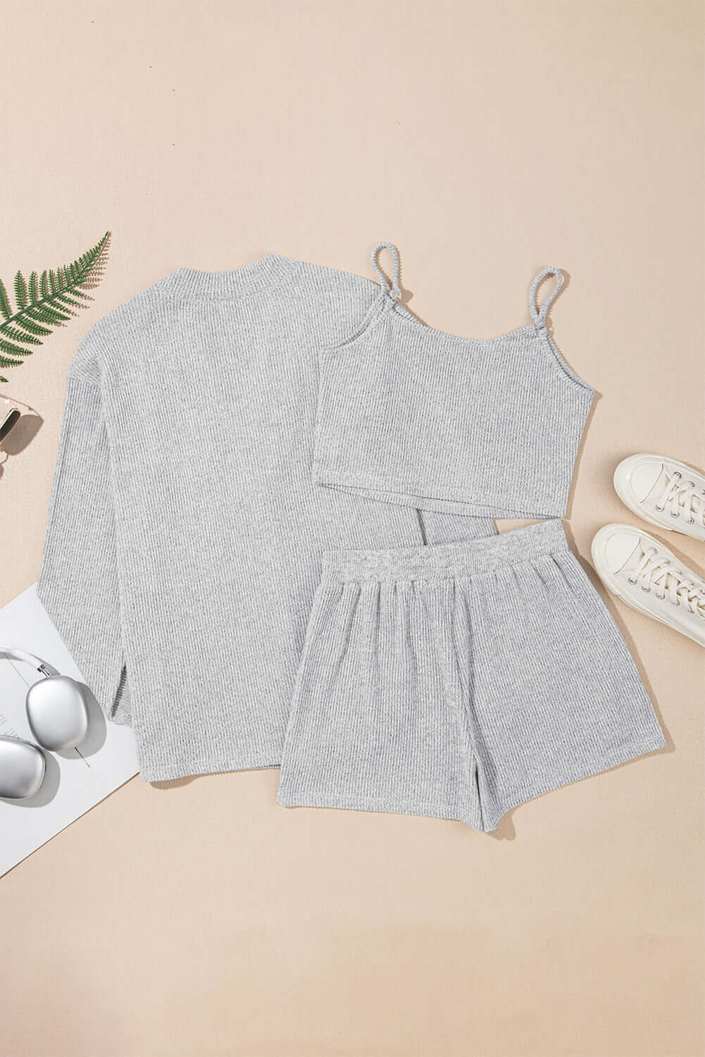 Light grey 3-piece ribbed crop camisole, shorts, and cardigan lounge set for women.
