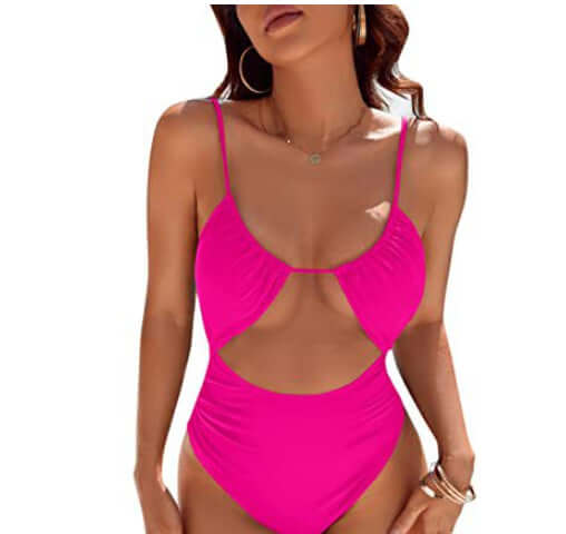 Stylish women&#39;s one-piece swimsuit in bright pink with cut-out design, perfect for beach or pool outings.