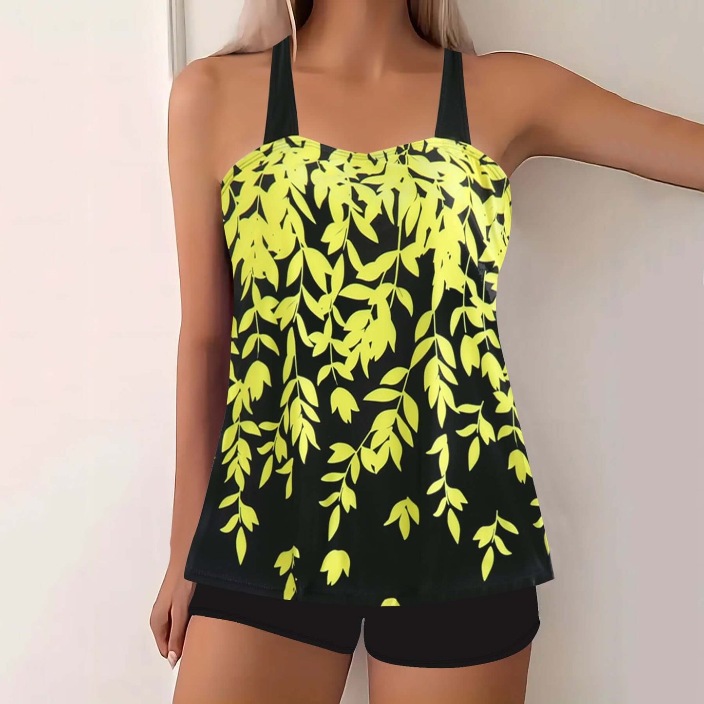 Plus size women's swimwear featuring a vibrant yellow leaf print on a black background, perfect for summer beach outings.