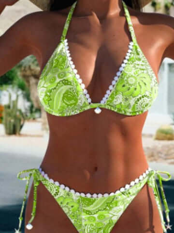 Bright green women's bikini split swimsuit with printed design and decorative trim, perfect for swimwear fashion.