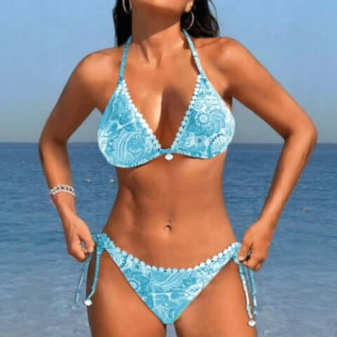 Women's bikini split swimsuit in blue with floral print, perfect for swimming and wading activities.