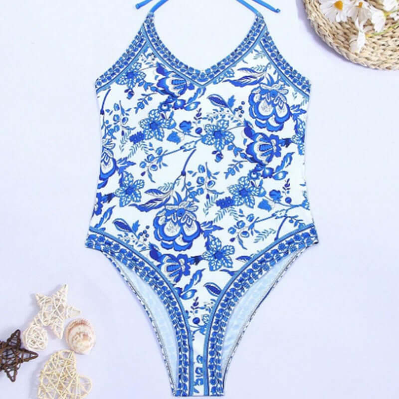 European American floral print halter backless swimsuit for women's summer swimwear, featuring elegant blue and white design.