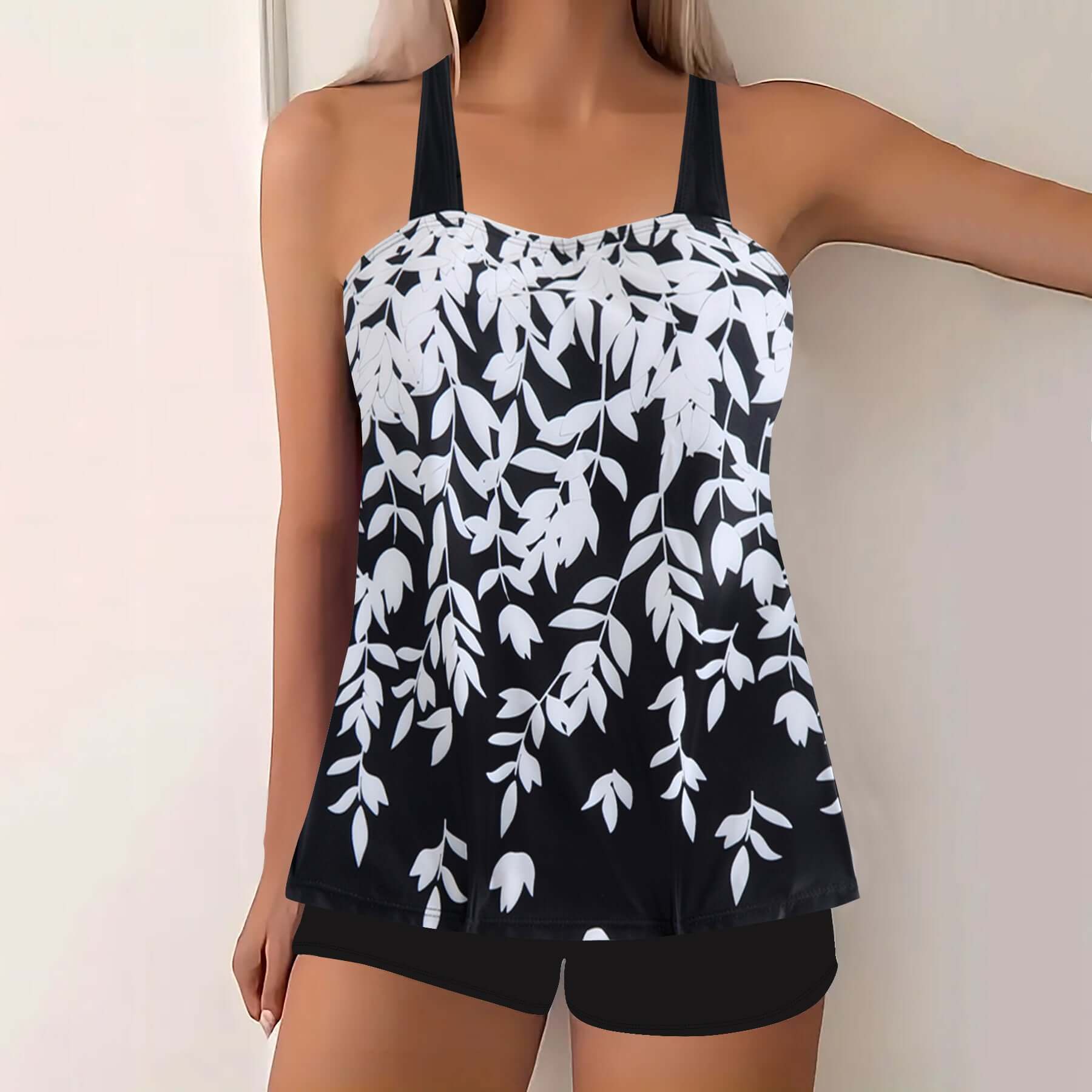 Women's swimwear featuring a striking split leaf print in black and white, perfect for summer poolside relaxation.