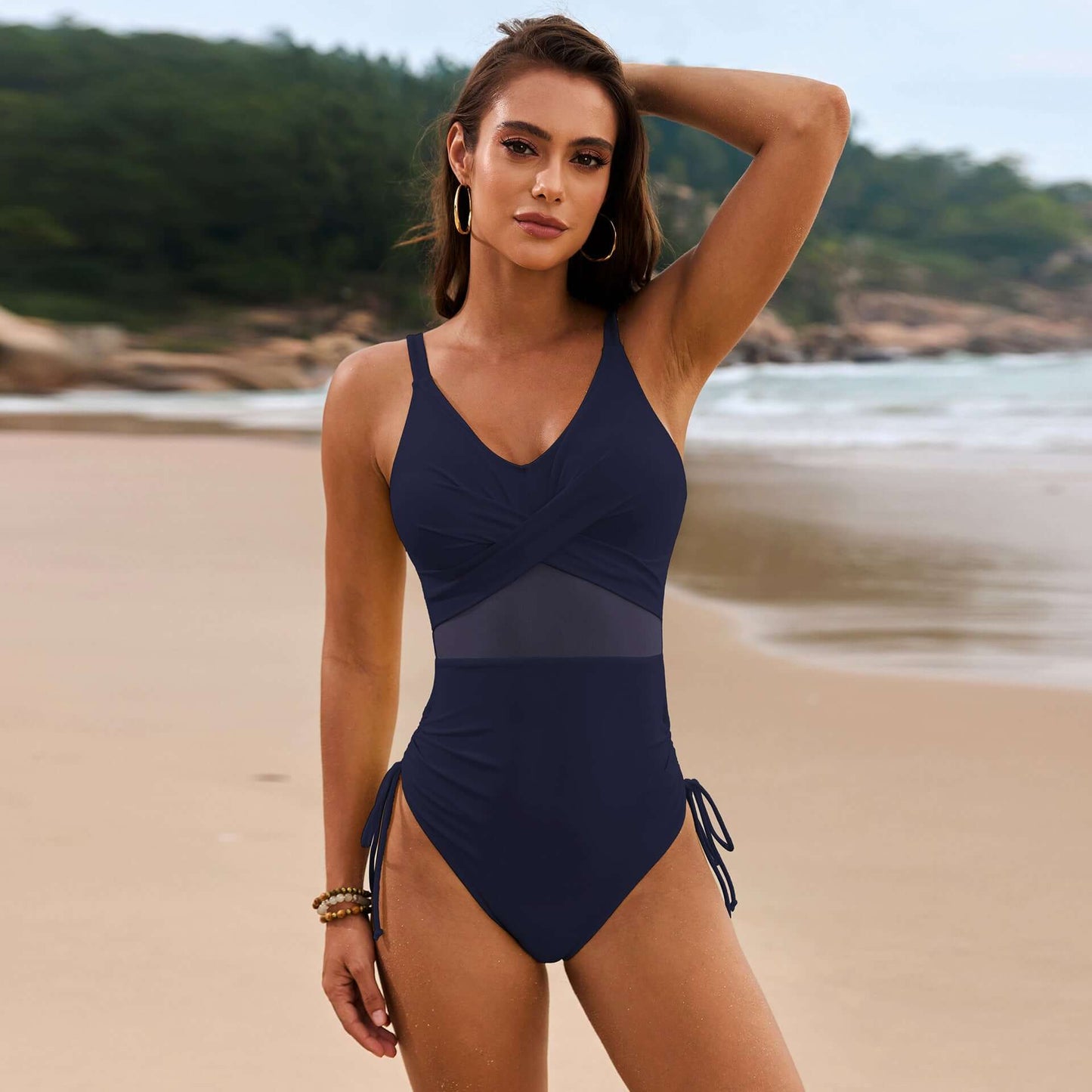Women's navy blue one-piece drawstring swimsuit, featuring mesh accents, perfect for swimming and wading.