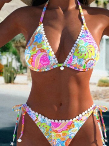 Colorful women's bikini split swimsuit with floral print and white tether accents, perfect for swimming and sunbathing.