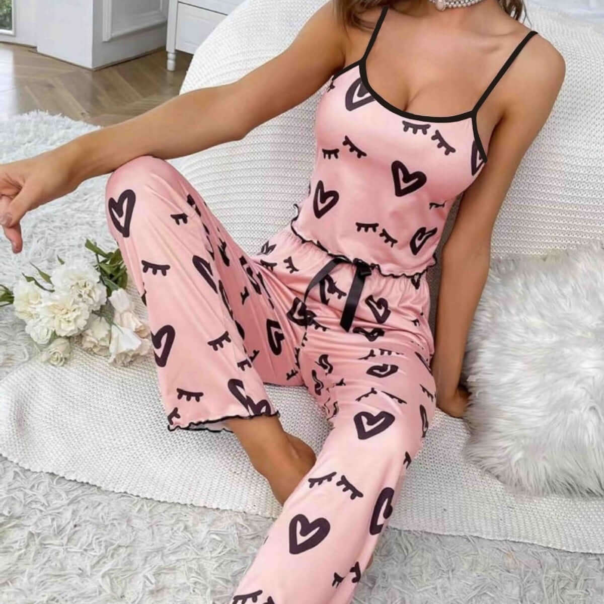 Two-piece pink milk silk suspender pajamas with heart pattern, ideal for casual and sleepwear.