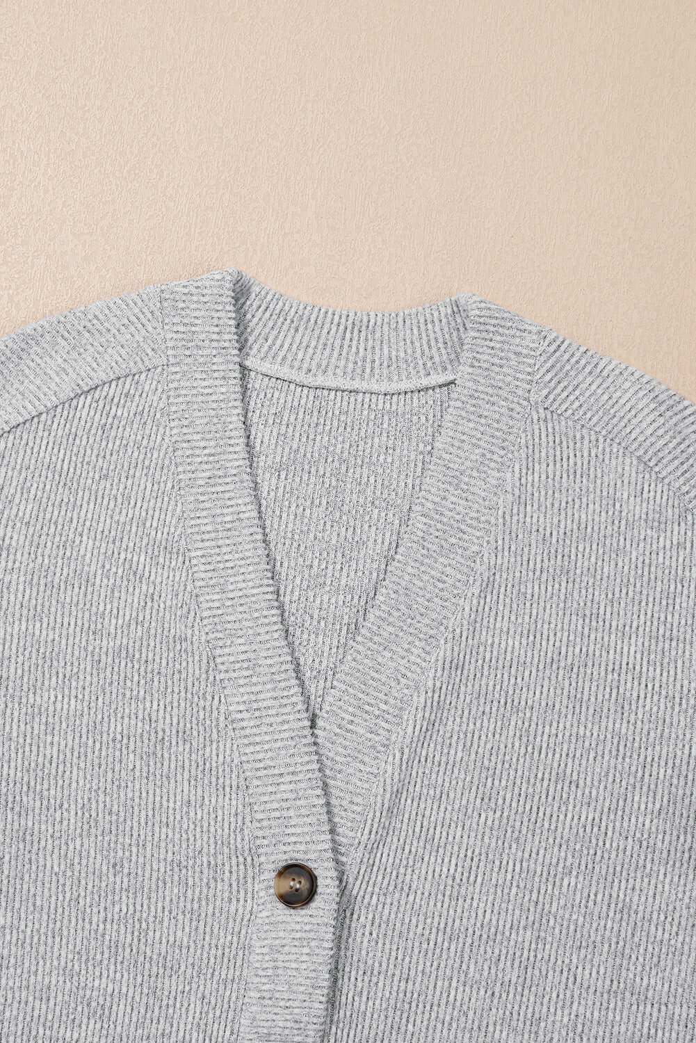 Light grey ribbed cardigan with button detail, part of a women's lounge set, perfect for cozy lounging.