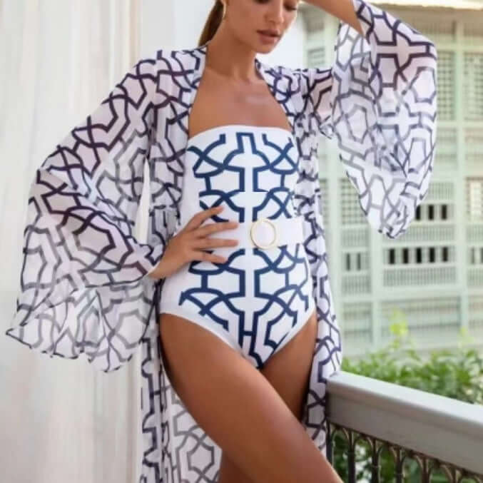 Model wearing a floral printed one-piece swimsuit with a flowy cover-up, showcasing women's swimwear style.
