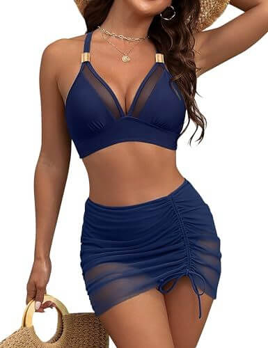 Fashionable women's swimwear featuring a navy blue mesh bikini top and ruched skirt, perfect for summer beach outings.