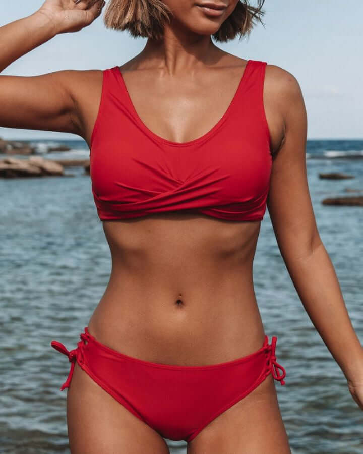 Fashion strappy bikini swimsuit for women in vibrant red, perfect for beach days and summer lounging.