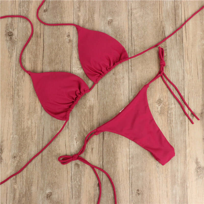 Halter neck tie bikini in vibrant red, perfect women's swimwear for summer beach outings.