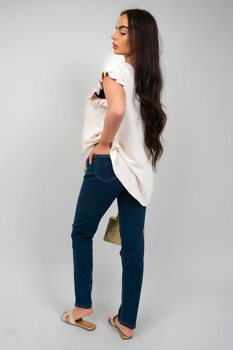 Model wearing Clara Straight Leg High Waist Jeans with a light top, showcasing a stylish casual look.