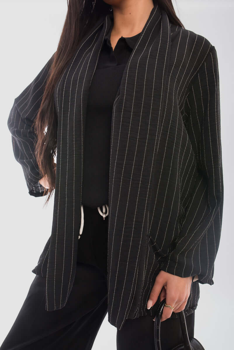 Oversized striped long sleeve cardigan with pockets, perfect for chilly days and stylish outfits.