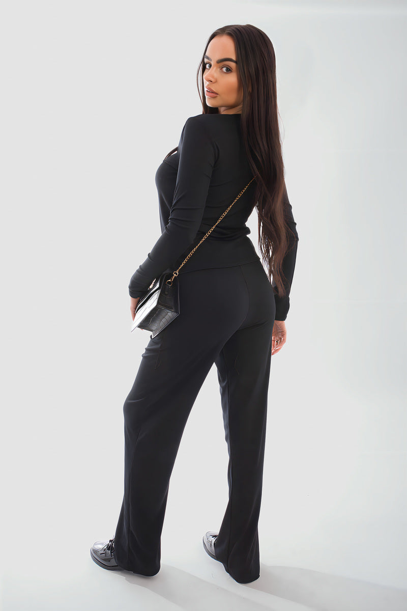 Model showcasing the Remi Long Sleeve Button Down Top & Trouser Co-ord Set in black, perfect for casual wear.