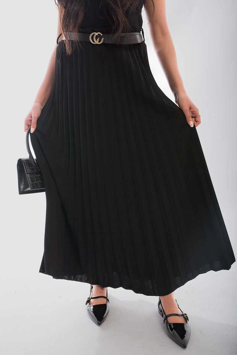 Belted maxi length pleated skirt made from organic cotton, featuring a relaxed fit and flowing design.